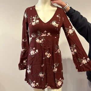 Long sleeve floral maroon romper.  Open back